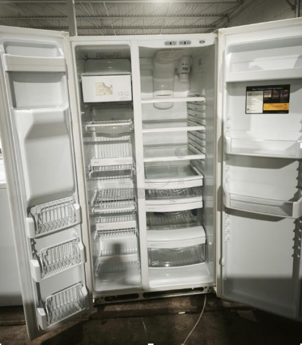 GE Eterna-series refrigerator, model ESS25LGMB, with open doors showing shelves, bins, and ice maker in good condition.