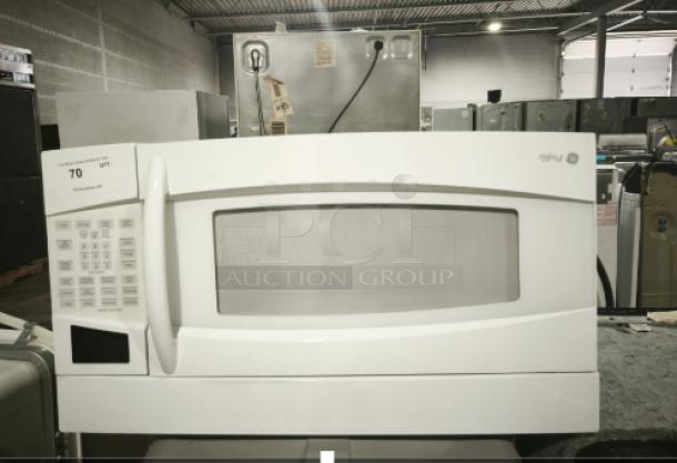 GE Profile Spacemaker 1.8 Cu. Ft. XL1800 Microwave, Model PVM1870DM3WW, white. Control panel left side, good condition.