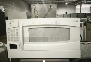 GE Profile Spacemaker 1.8 Cu. Ft. XL1800 Microwave, Model PVM1870DM3WW, white. Control panel left side, good condition.