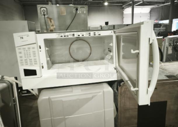 GE Profile Spacemaker® 1.8 Cu. Ft. XL1800 Microwave, Model PVM1870DM3WW, white, condition appears used, door open displaying interior.