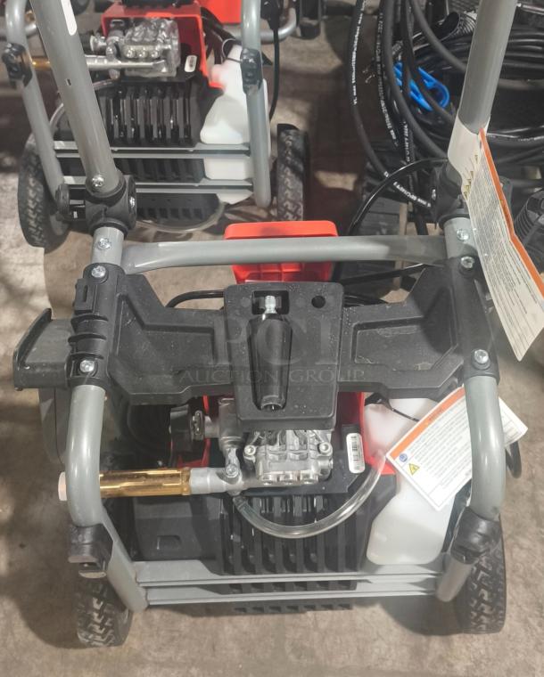 Husqvarna PW2300 electric pressure washer, tested and working. Features durable frame, visible hose connections, and product label.