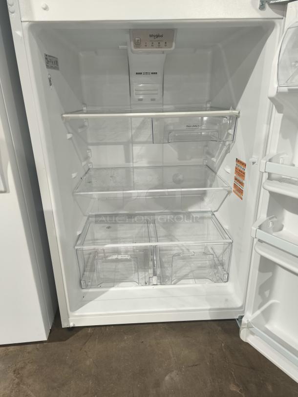 Whirlpool 30-inch top-freezer refrigerator, model WRT318FZDW, 18 cu ft, interior view. Clean and tested, shelves installed.