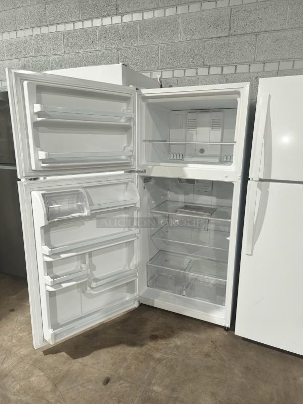 Whirlpool 30-inch wide top-freezer refrigerator, model WRT318FZDW11, 18 cu ft, white, open doors, shelves visible.