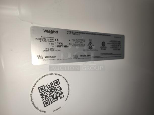 Whirlpool 30-inch top-freezer refrigerator, model WRT318FZDW11, 18 cu ft. Label shows specs and serial VSE3258697.