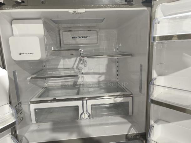 Samsung 28 cu ft 4-Door French Door Refrigerator, model RF4287HARS, with FlexZone™ Drawer. Features Twin Cooling Plus™ and Space Ice Maker. Interior view, excellent condition.