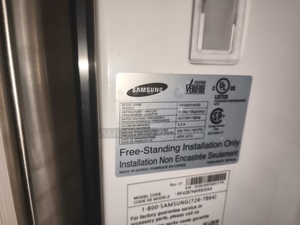 Samsung 28 cu ft 4-Door French Door Refrigerator, model RF4287HARS, label shows specs and UL certification, tested working.