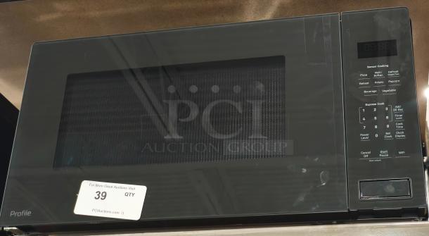 BRAND NEW scratch and dent GE Profile 2.2 cu ft built-in sensor microwave, model PCWK22U1WDD, visible control panel.