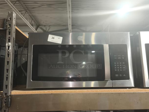 BRAND NEW GE 1.6 cu ft over-the-range microwave, model PVM9005SJ8SS; stainless steel, scratch and dent condition; control panel visible.