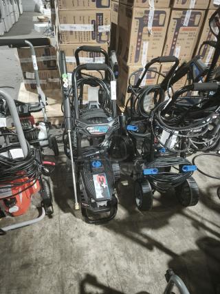 AR Blue Clean XP3-2400 electric pressure washer, tested and working. Features 2400 PSI, sturdy wheels, and hose reel.
