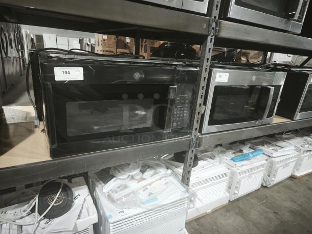 Brand new GE JVM3160DFBB over-the-range microwave, 1.6 cu ft, black, scratch and dent; stored on shelf with label.
