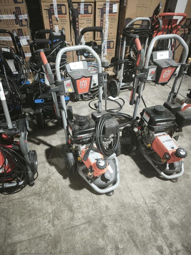 Husqvarna PW-3200 3200 PSI gas pressure washer, model 022007, tested and working. Features sturdy frame and accessory holder.