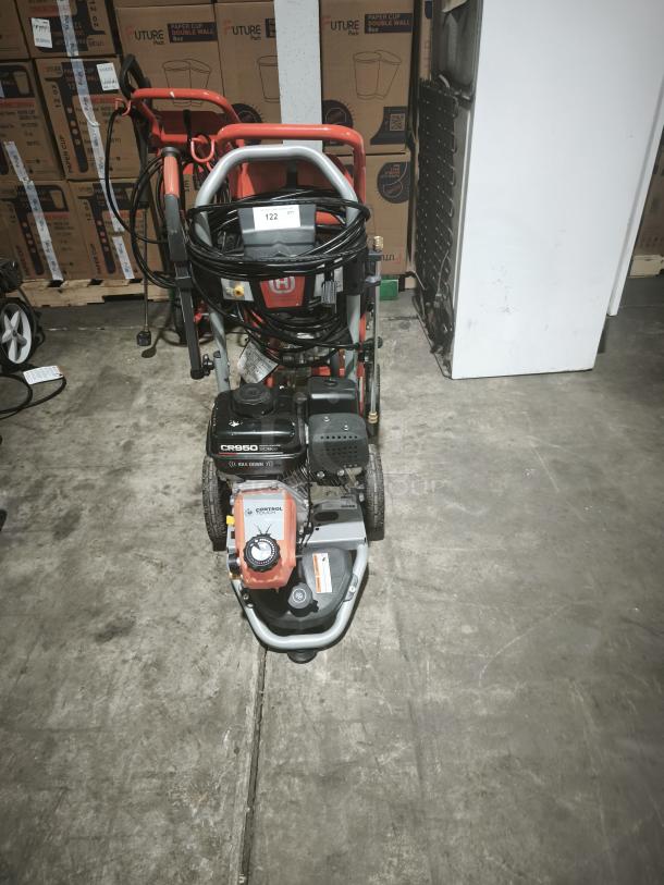 Husqvarna PW-3200 gas pressure washer, model 022007, 3200 PSI, tested and working condition, includes hose and attachments.