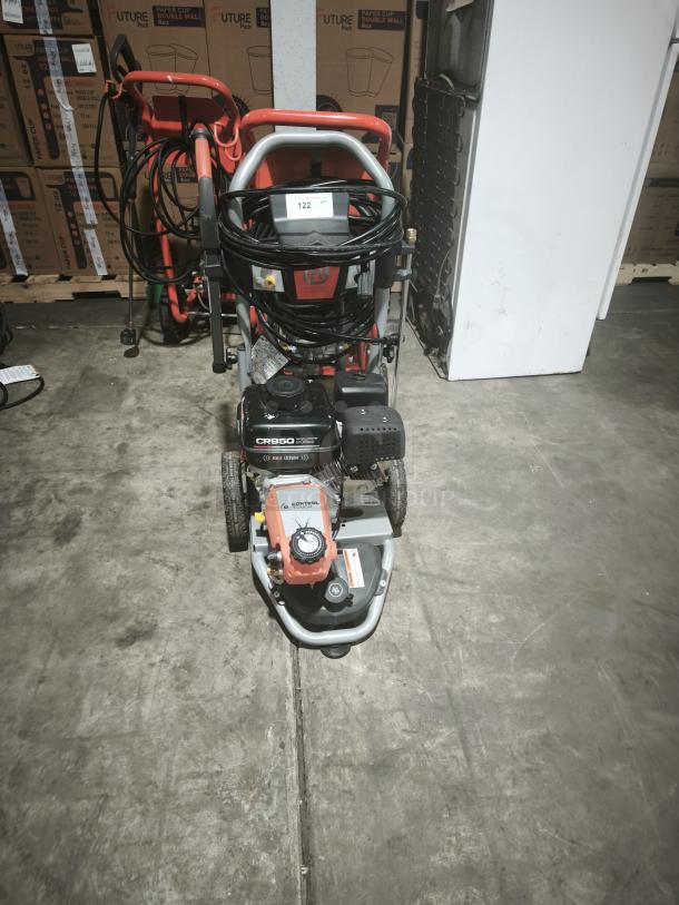 Husqvarna PW-3200 gas pressure washer, model 022007, in working condition. Features 3200 PSI output. Visible label indicates model details.