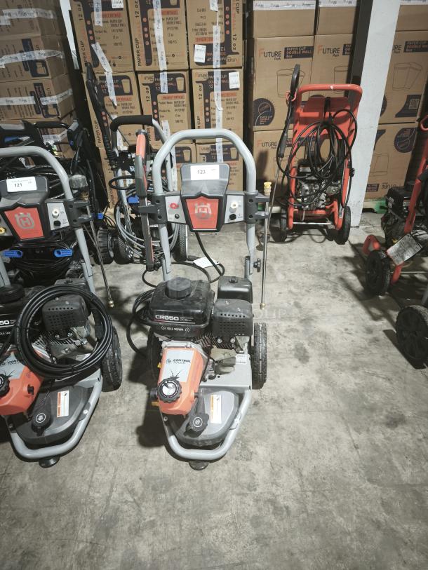 Husqvarna PW-3200 pressure washer, model 022007, tested working, 3200 PSI, gas-powered, sturdy design, visible logo.