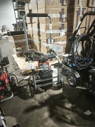 Husqvarna PW2300 electric pressure washer, tested and working. Features sturdy frame, wheels, and control panel.