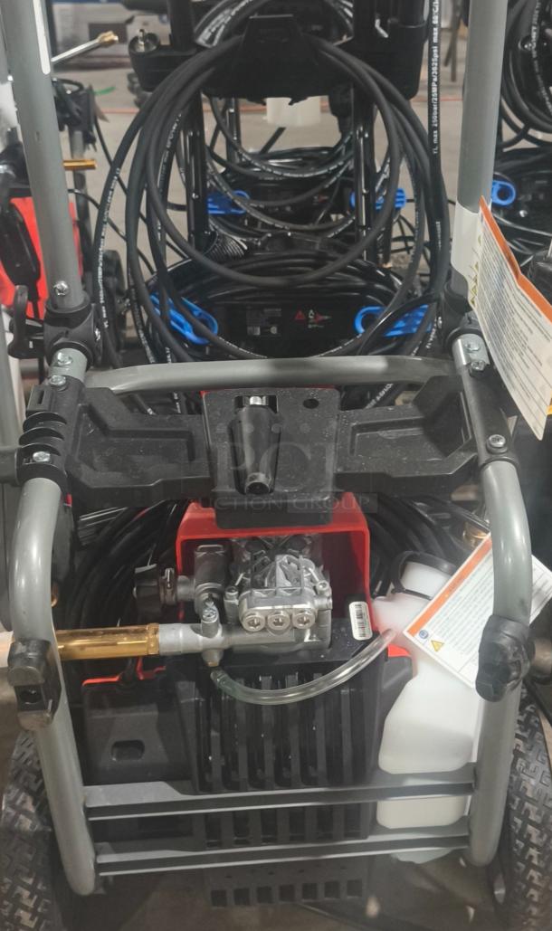 Husqvarna PW2300 Electric Pressure Washer, tested and working, features sturdy frame, hose storage, and visible labels.