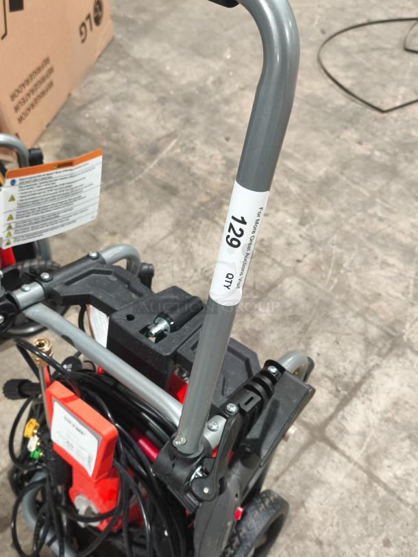 Husqvarna PW2300 electric pressure washer, tested and working, with durable handle and coiled hose, model label visible.