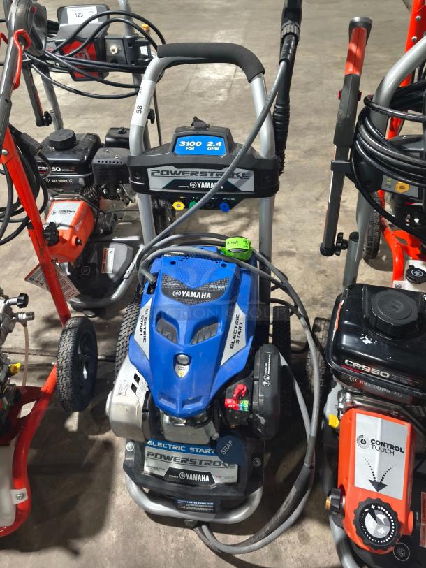 AR Blue Clean XP3-2400 Electric Pressure Washer, used condition, with visible hose and power controls, suitable for heavy-duty cleaning.