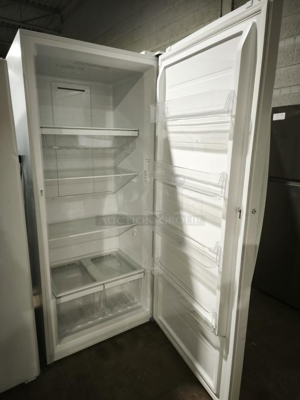 GE 21.3 Cu. Ft. Frost-Free Upright Freezer, model FUF21DLRWW, like new. Features multiple shelves and door bins.