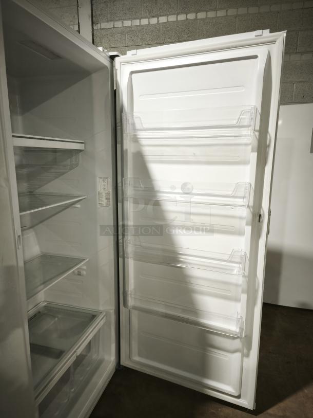 LIKE NEW GE 21.3 Cu. Ft. Frost-Free Upright Freezer, Model FUF21DLRWW. Features glass shelves and door bins. Excellent condition.