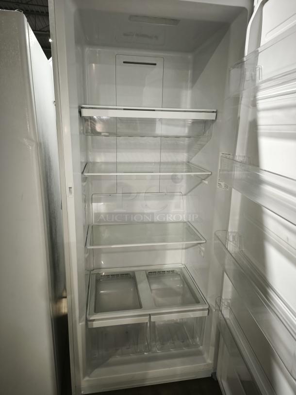 GE 21.3 Cu. Ft. Frost-Free Upright Freezer, Model FUF21DLRWW, like new, multiple shelves, clear bins, pristine condition.