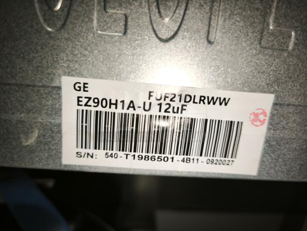 Label on GE FUF21DLRWW upright freezer showing model, barcode, and serial number details. Like new condition.