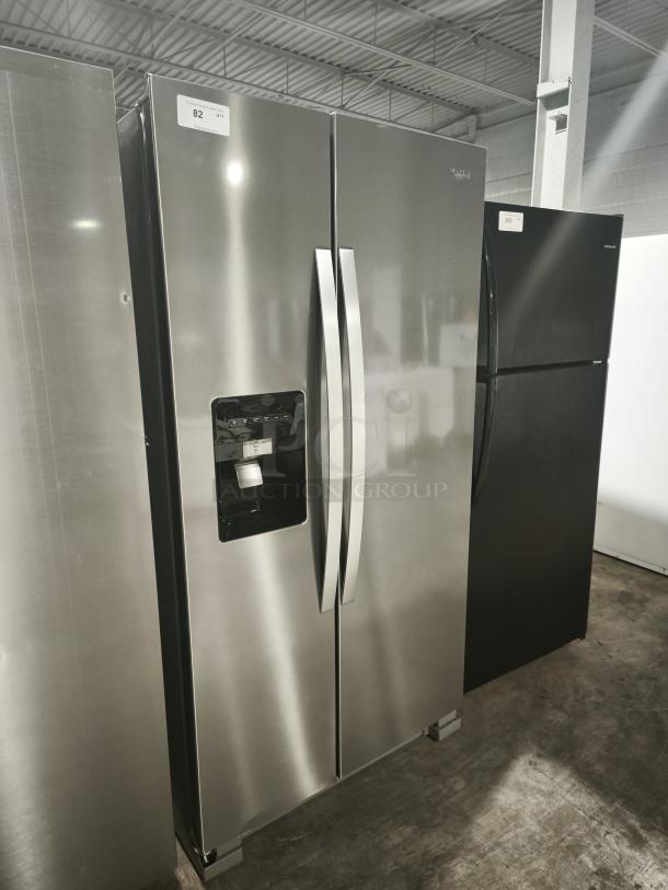 Whirlpool 36-inch side-by-side refrigerator, model WRS315SDHZ19, like new, stainless steel finish, water and ice dispenser.