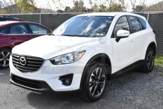 2016 Mazda CX-5 Grand Touring 4WD in white. Excellent condition, includes key. VIN: JM3KE4DY0G0778964.