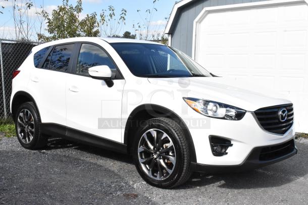 2016 Mazda CX-5 Grand Touring 4WD, white, excellent condition, key included, VIN JM3KE4DY0G0778964, sleek design.