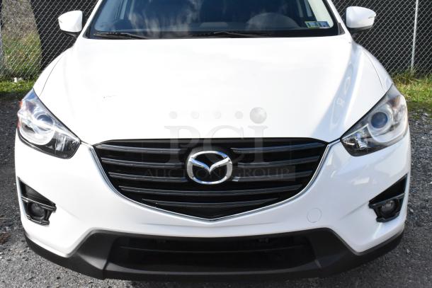 2016 Mazda CX-5 Grand Touring 4WD in white, front view, clean condition. VIN JM3KE4DY0G0778964, includes key.
