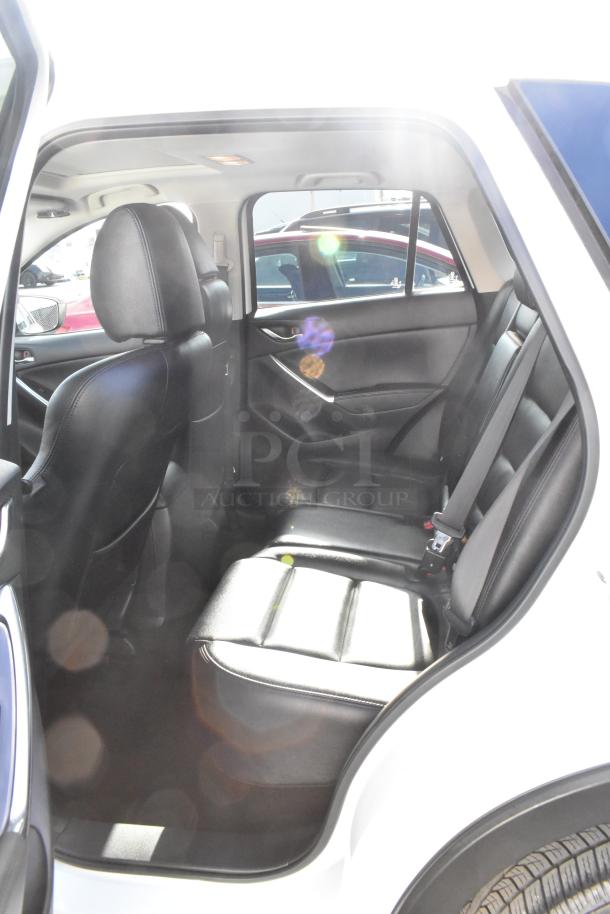 2016 Mazda CX-5 Grand Touring 4WD interior, black leather seats, well-maintained, spacious rear seating, VIN JM3KE4DY0G0778964.