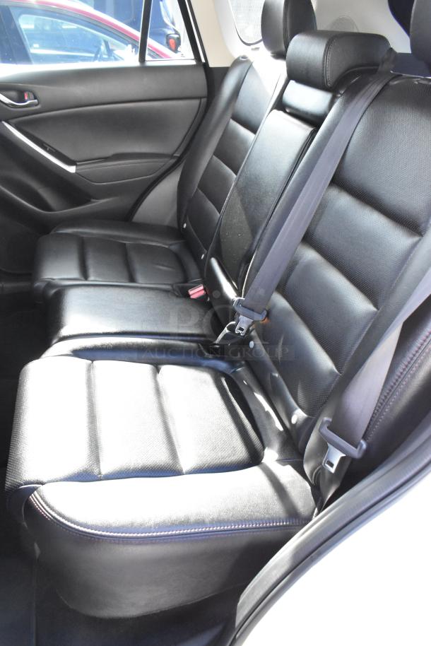 2016 Mazda CX-5 Grand Touring 4WD SUV interior, black leather seats with minimal wear, VIN JM3KE4DY0G0778964.