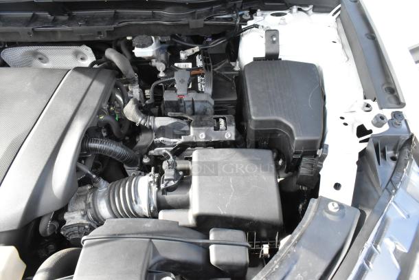 Engine compartment of a 2016 Mazda CX-5 Grand Touring 4WD. Clean condition, components appear intact. VIN JM3KE4DY0G0778964.