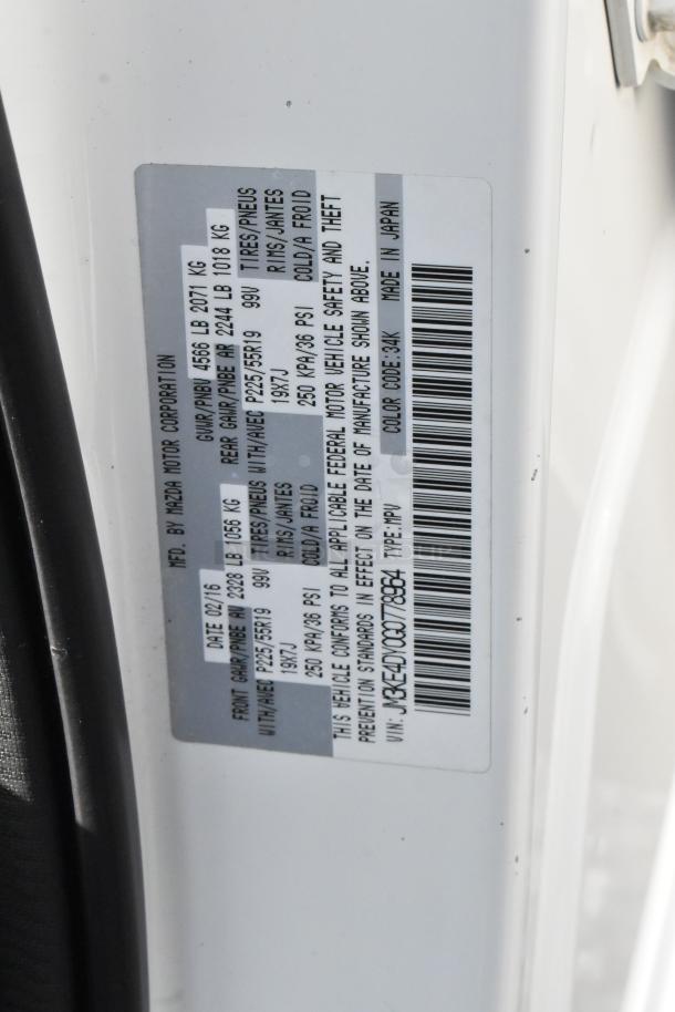 Label on 2016 Mazda CX-5 Grand Touring 4WD. VIN JM3KE4DY0G0778964. Manufactured 02/16, tire info P225/55R19. Color code: 34K. Made in Japan.