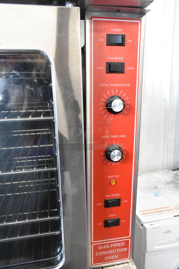 Migali stainless steel commercial convection oven with view-through doors, metal racks, thermostatic controls, and casters.