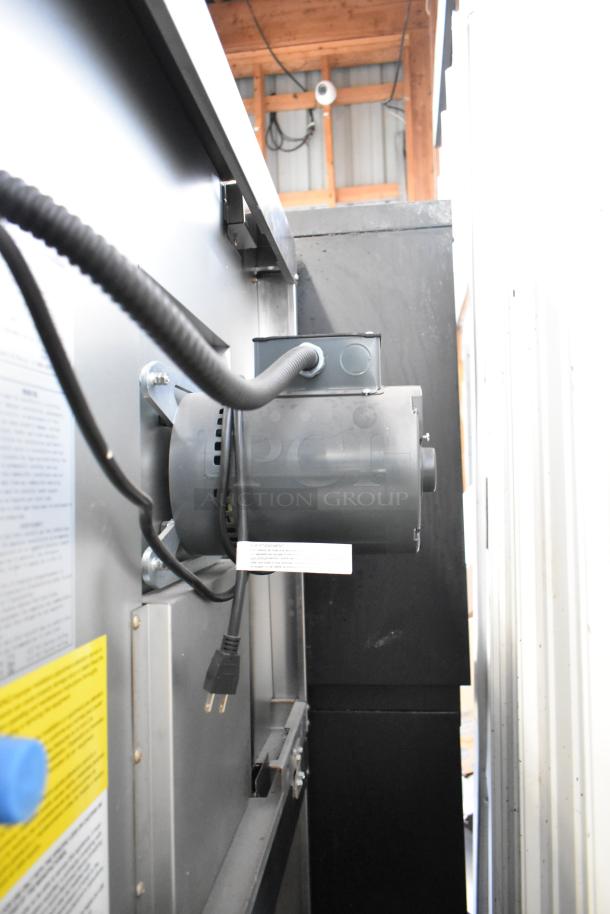 Migali stainless steel commercial convection oven, view-through doors, metal racks, thermostatic controls, on casters.
