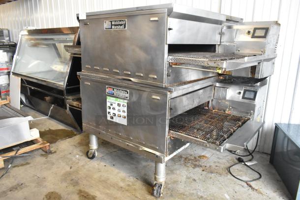 2 Middleby Marshall PS638G stainless steel commercial natural gas conveyor pizza ovens, 89,000 BTU, on casters.