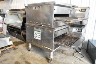 2 Middleby Marshall PS638G stainless steel commercial natural gas conveyor pizza ovens, 89,000 BTU, on casters.