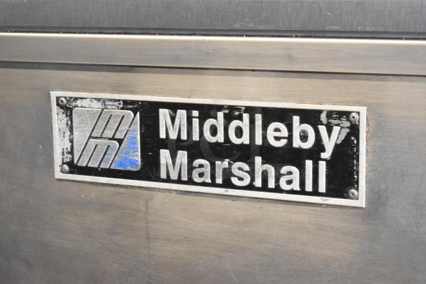 Middleby Marshall PS638G stainless steel conveyor pizza oven, natural gas, 89,000 BTU, commercial casters, brand logo visible.