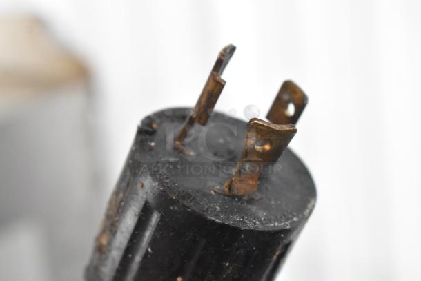 Close-up of a rusted plug for a Middleby Marshall PS638G pizza oven, showing signs of wear.
