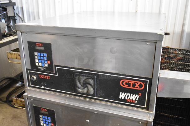 Two 2023 Middleby Marshall CTX DZ33I stainless steel electric conveyor pizza ovens on casters, 208 volts, with control panel.