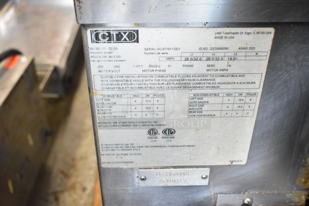Middleby Marshall CTX DZ33I stainless steel conveyor pizza oven, electric, 208V, 3/1 phase, commercial casters, label visible.