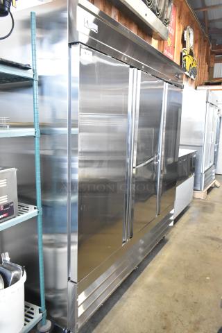 Avantco 178SS3FHC stainless steel commercial 3-door reach-in cooler, brand new with minor scratches and dents, on casters.