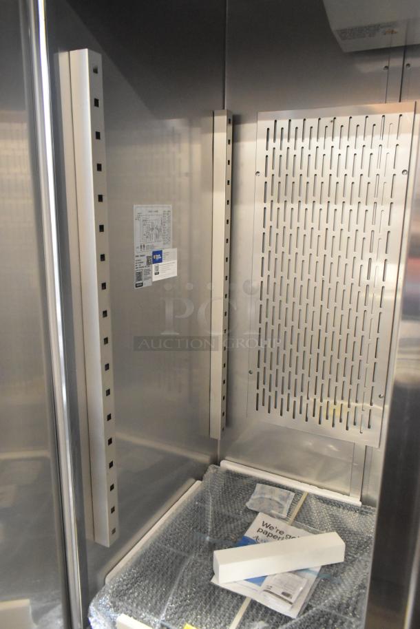 BRAND NEW Avantco 178SS3FHC 3-door cooler, stainless steel, poly-coated racks, commercial casters, 115V, 1-phase, tags visible.