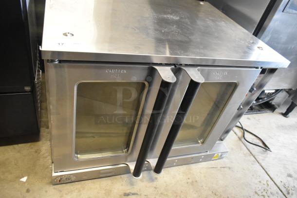 Brand new Cooking Performance Group CPG 351FEC100C stainless steel single deck electric convection oven with view-through doors.