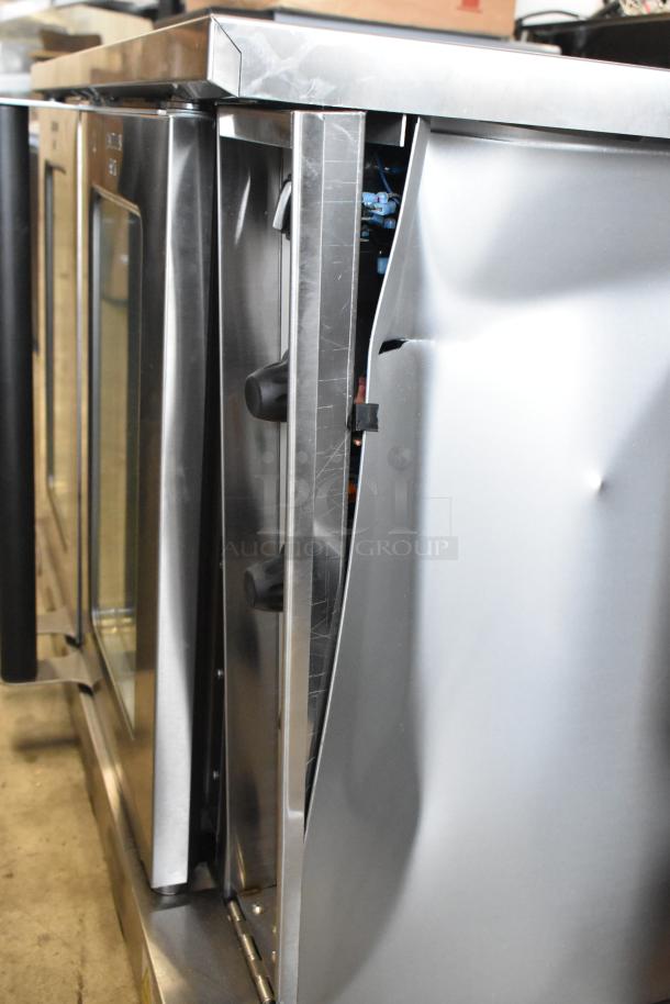 BRAND NEW Cooking Performance Group 351FEC100C stainless steel convection oven, single deck, view-through doors, dented side.
