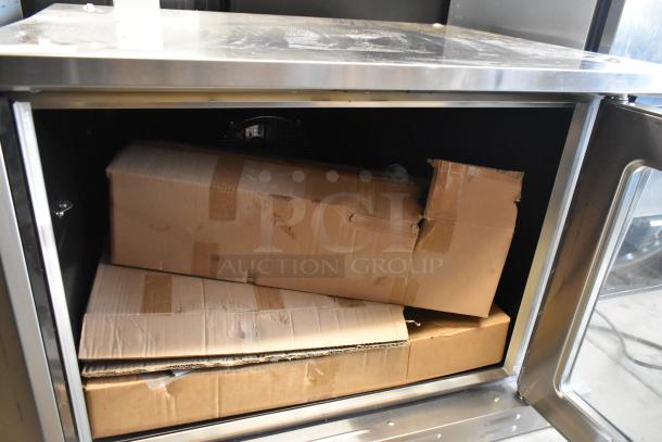 Brand new Cooking Performance Group 351FEC100C convection oven, scratch and dent condition, stainless steel, view through doors.