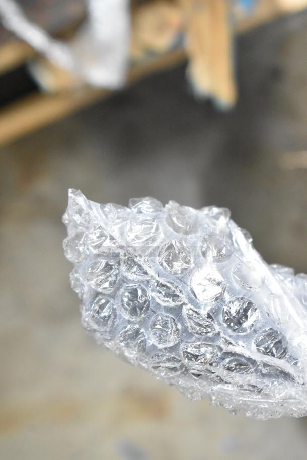 Bubble wrap for packaging the Avantco 177CHSME32IM 32" Electric Countertop Cheese Melter.