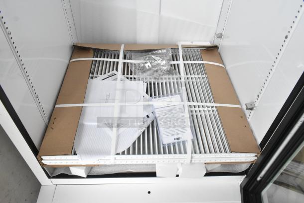 Brand new True TSCI-600R-G-PH metal commercial cooler with poly coated racks, 115V, 1 phase. Includes documents and packaging.