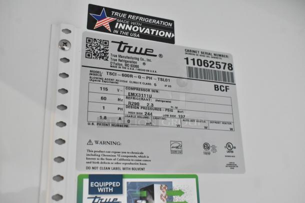 True TSCI-600R-G-PH metal cooler merchandiser label showing model details, serial number, 115V, single-phase, refrigerant R290.